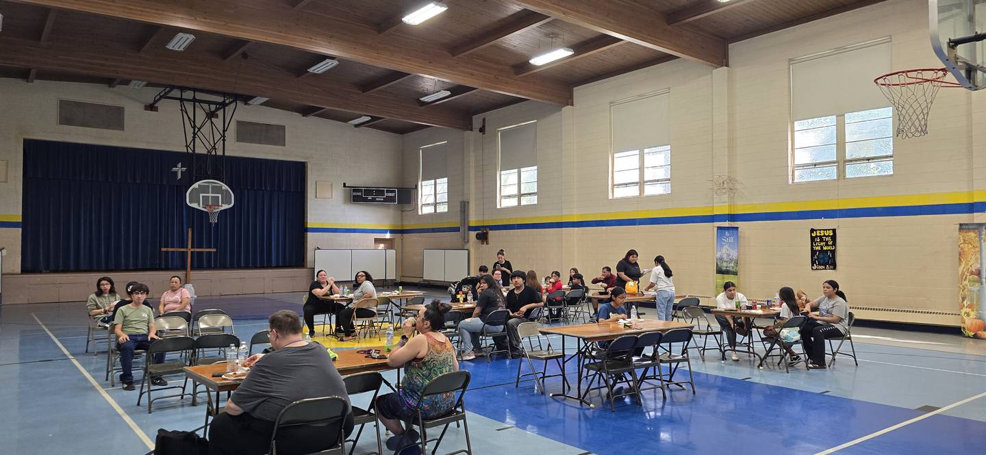The annual Bicentennial Bluffs Neighborhood Association spring cleanup on Saturday, May 2, 2026, in Joliet will include free doughnuts, a raffle and a free "thank you, lunch." In this photos, volunteers gather for the fall 2025 cleanup.