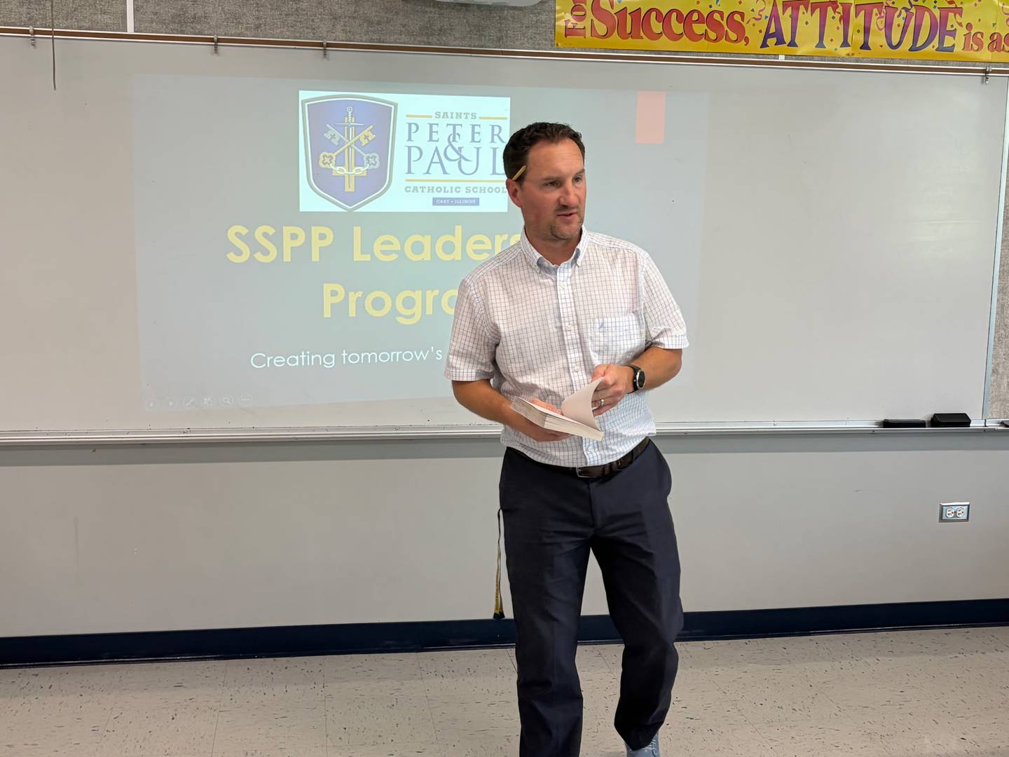 Saints Peter and Paul music teacher Brett Fisher teaches eighth-graders in the Cary-based school's new leadership program on April 23, 2026.