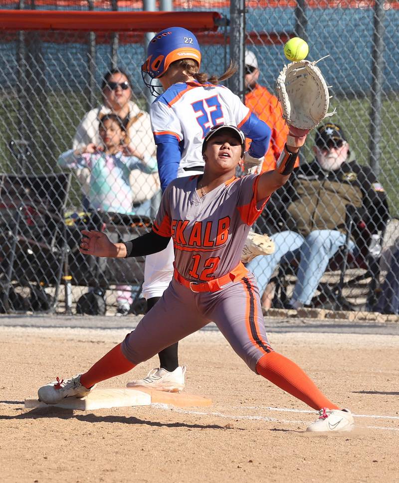 Genoa-Kingston's Brooklynn Ordlock beats the throw to DeKalb's Alaynna Johnson for an infield single Thursday, May 8, 2025, during their game at Genoa-Kingston High School.