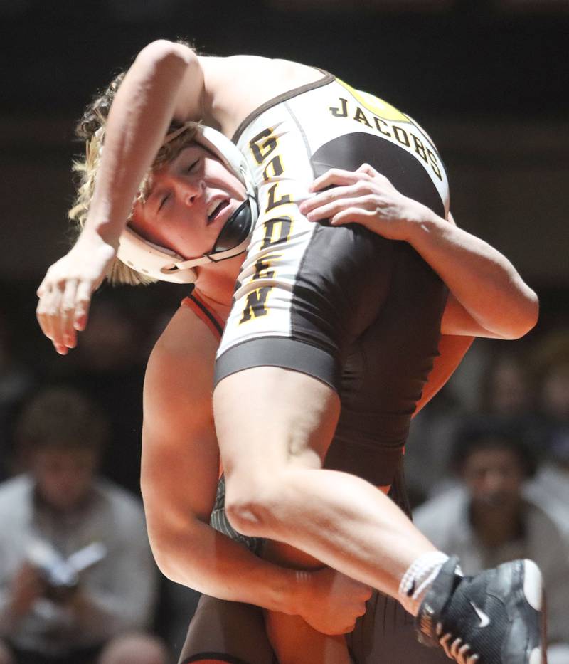Crystal Lake Central’s Dylan Ramsey hoists Jacobs’ Gavin Greco at 126 pounds in varsity boys wrestling on Tuesday, Jan. 20, 2026 at Crystal Lake Central High School in Crystal Lake.
