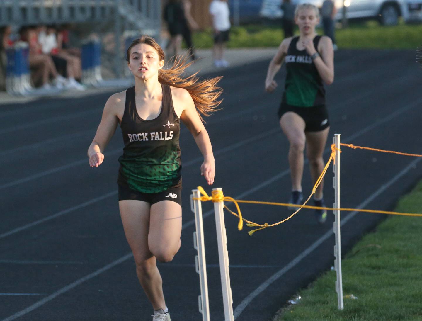 Rock Falls' Hana Ford wins the 800 meter run as teammate Kat Scott finishes runner-up during the Ferris Invitational on Monday, April 15, 2024 at Princeton High School.