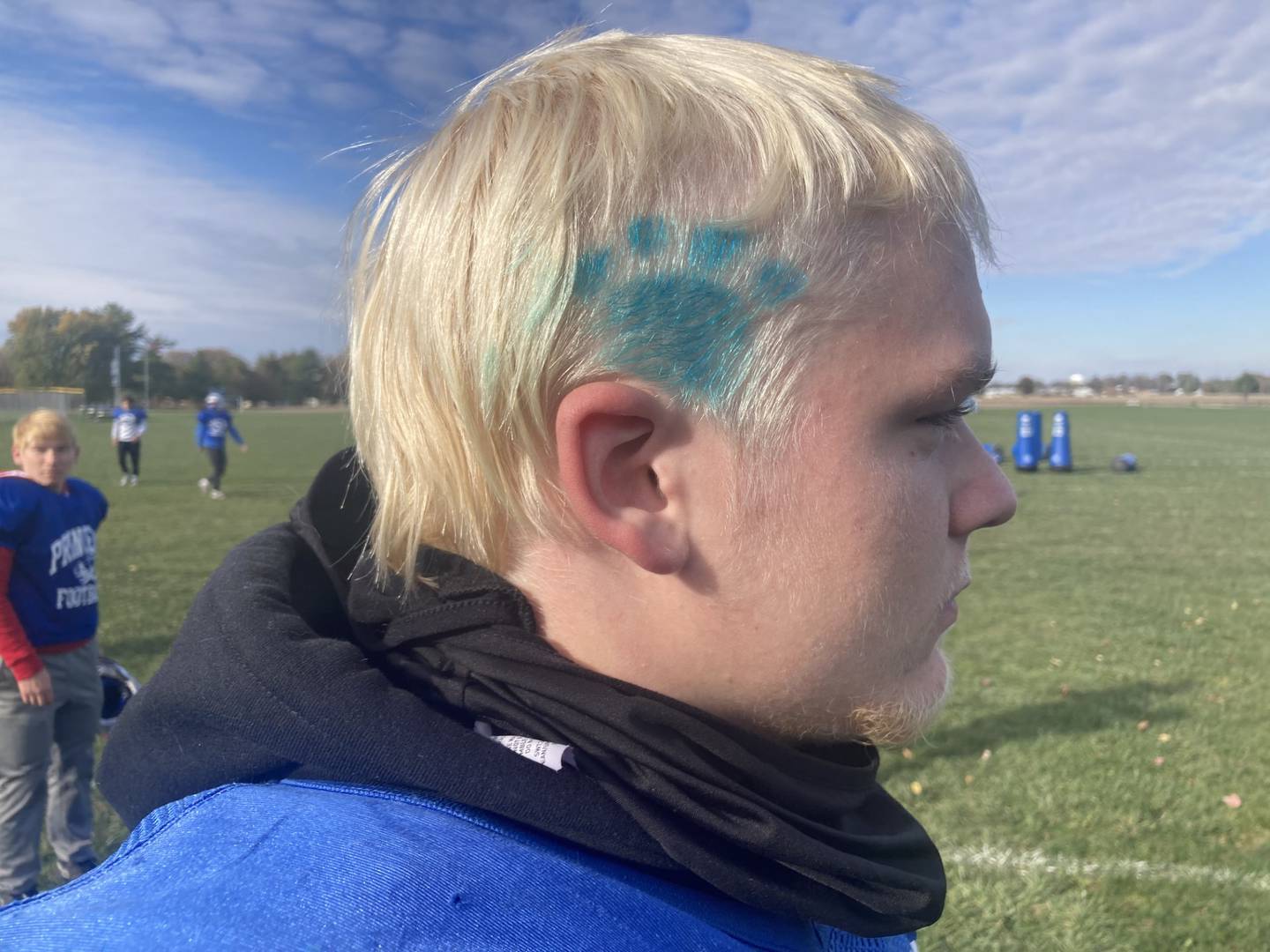 PHS senior Daniel Sousa, a natural blonde, has added a blue Tiger paw to show his team colors.