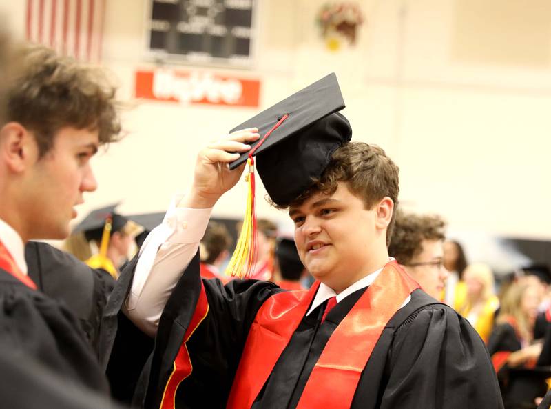 Batavia High School graduate Nolan Bainter puts his cap on before the school’s 2023 commencement ceremony at Northern Illinois University in DeKalb on Wednesday, May 24, 2023.