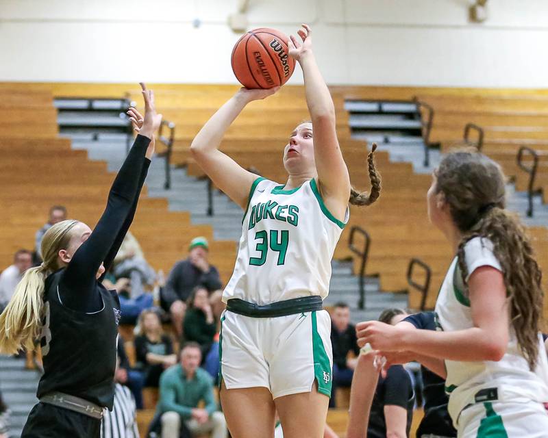 York's Olivia Silkaitis (34) puts up a shot in their York Thanksgiving Tournament game between Oswego East at York on Monday, Nov 18, 2024  in Elmurst.