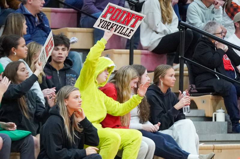 A Yorkville fan holds up a sign in celebration after Yorkville scored a point against Oswego during the Class 4A Yorkville Regional final at Yorkville High School on Thursday, Oct. 31, 2024.
