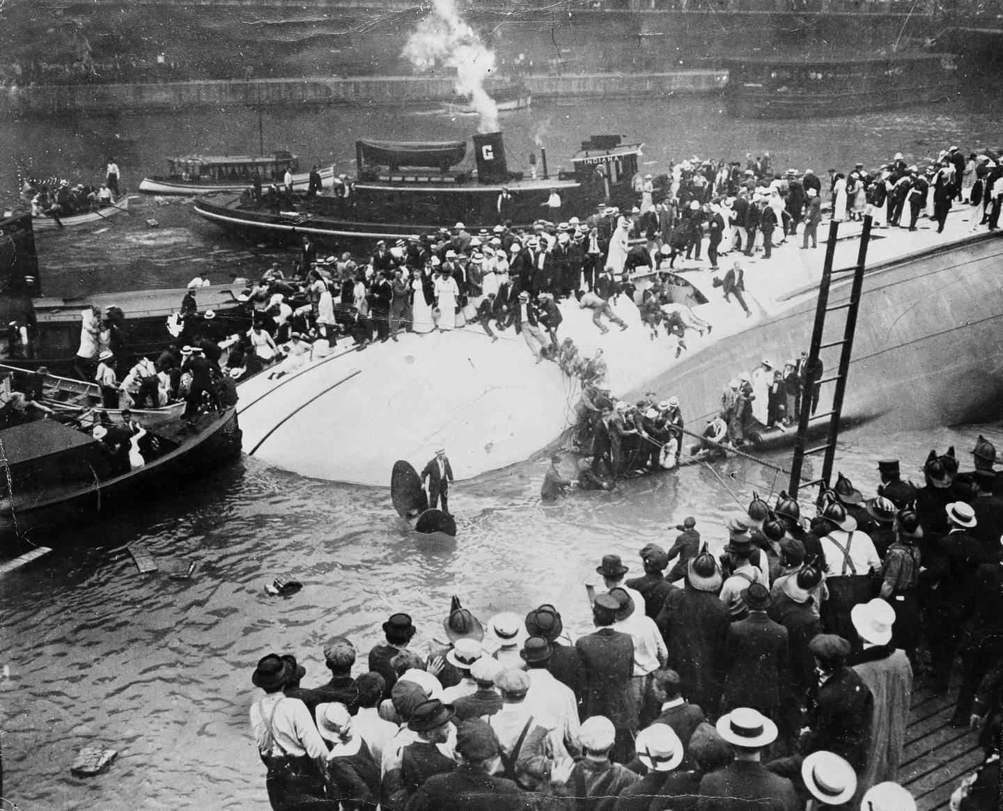 Rescue efforts are shown on the SS Eastland excursion boat, which was chartered to take thousands of Western Electric Co.'s employees to a picnic but capsized just 20 feet from the wharf at Chicago on July 24, 1915. The death toll was 844, 70% of them under age 25.