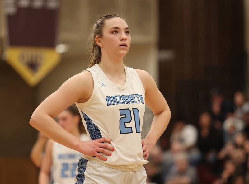 Nazareth's Olivia Austin (21) waits to shoot freethrows during the girls 3A varsity super-sectional game between Nazareth Academy and Fenwick High School in River Forest on Monday, Feb. 27, 2023.