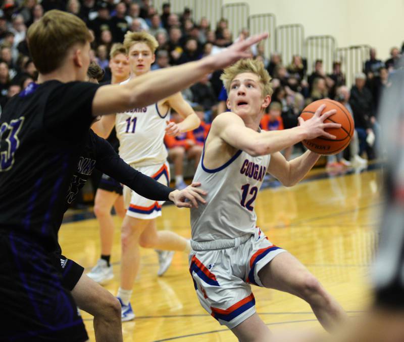 Eastland's Adam Awender (12) drives to the basket against Pecatonica during the championship game of the 1A River Ridge sectional on Friday, March 1, 2024.