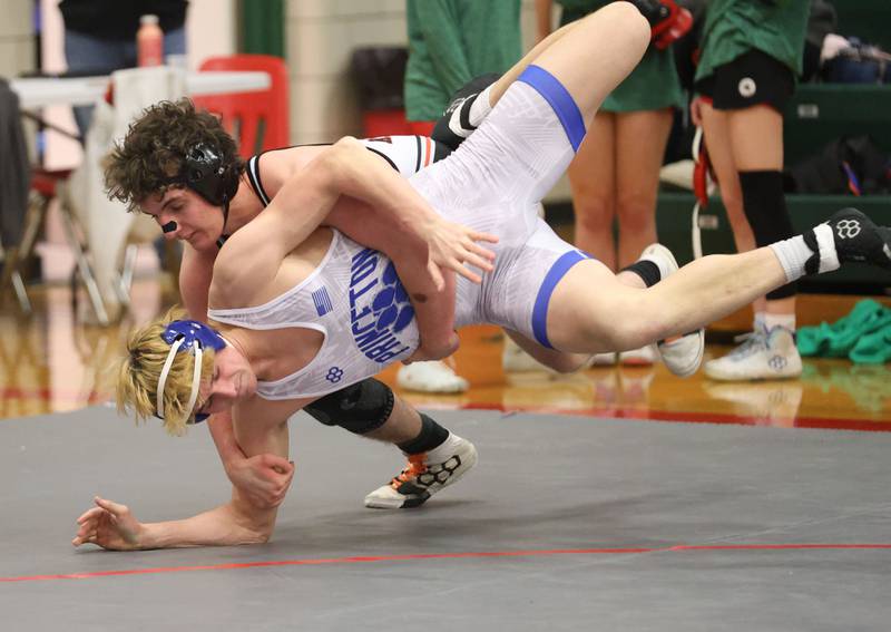 Kaneland's Apollo Gochis wrestles Princeon's Landon Kendall during a meet on Thursday, Jan. 22, 2026 in Sellett Gymnasium at L-P High School.