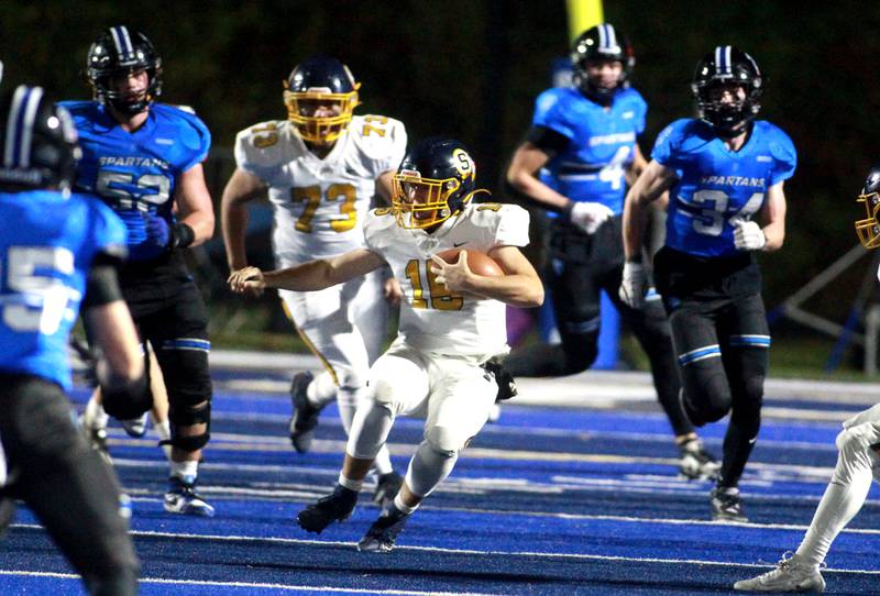 Sterling quarterback Drew Nettleton keeps the ball during a Class 5A first-round game against St. Francis on Friday, Nov. 1, 2024 in Wheaton.