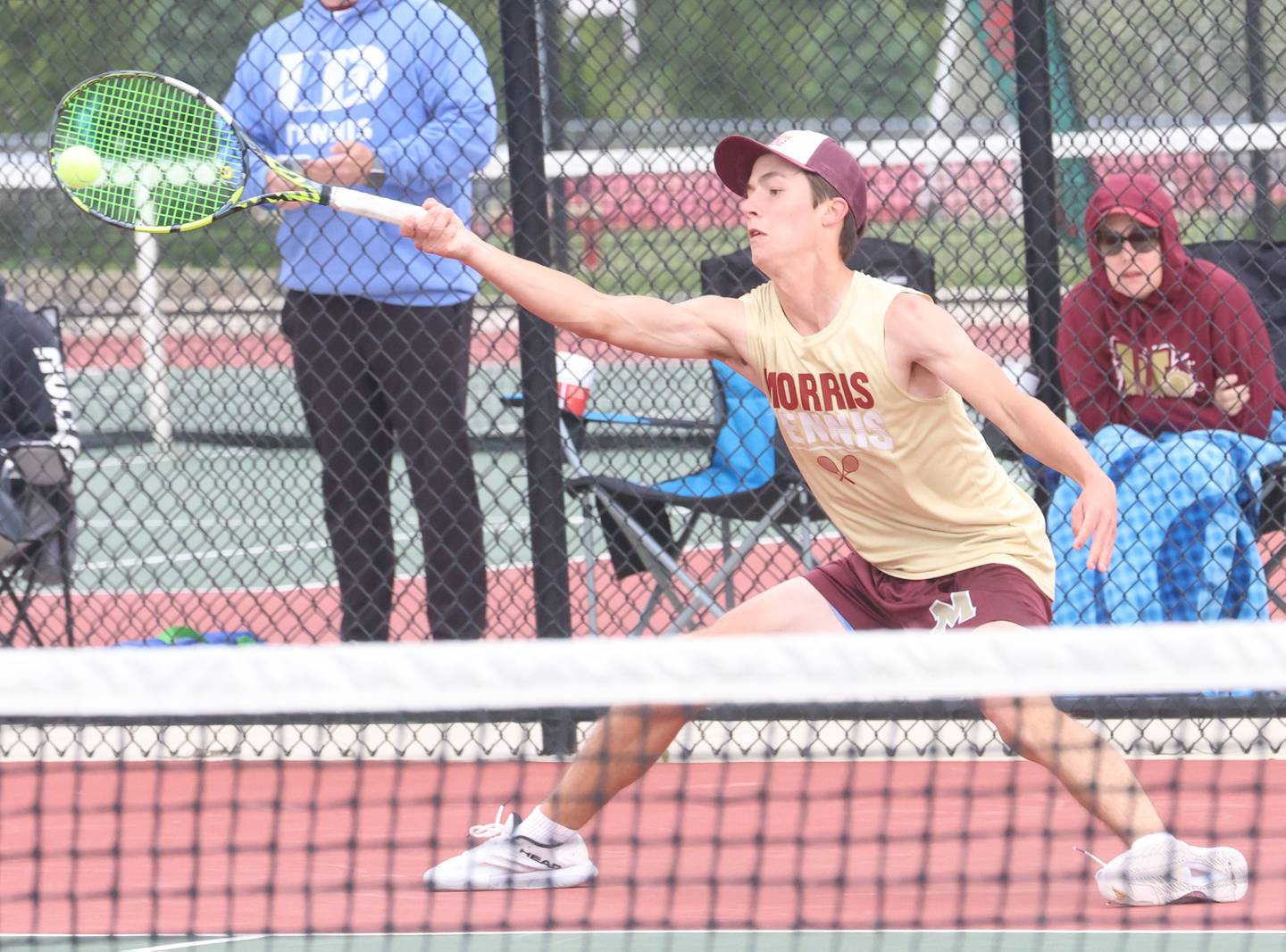Morris's Connor Barth returns a serve during the Class 1A Sectional tennis meet on Friday, May 22, 2026 at the La Salle-Peru Township High School Athletic Complex in La Salle.