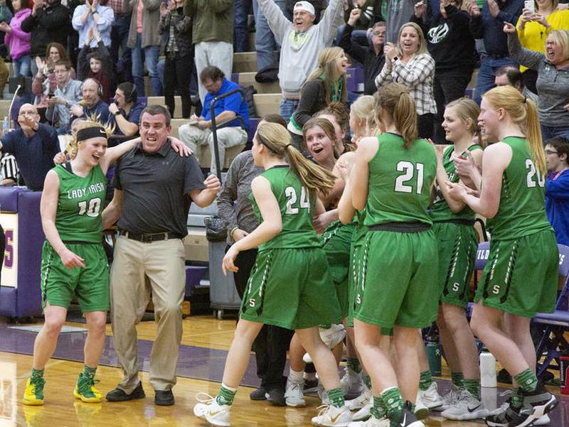 Ted O'Boyle (second from left) celebrates a Seneca girls basketball sectional semifinal victory over Prairie Central at Wilmington High School in this file photo. As of July 1, 2022, O'Boyle has fully taken over as Seneca's athletic director.