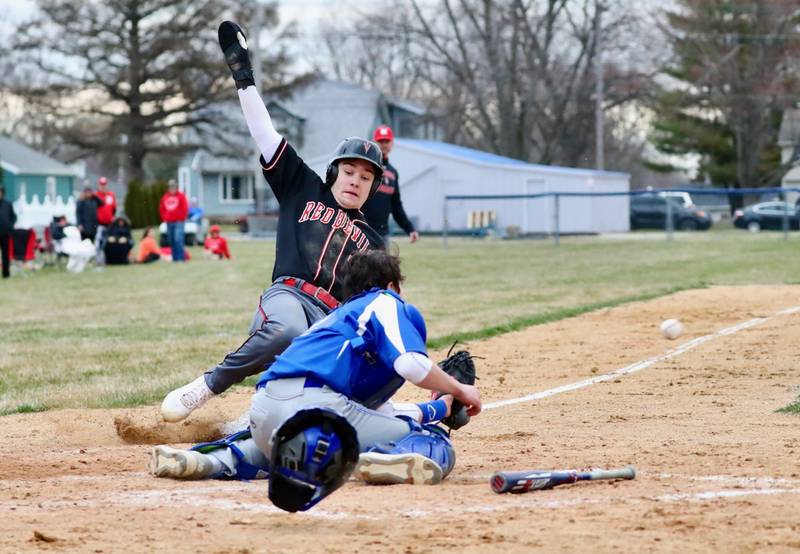 Princeton catcher Ace Christiansen takes the throw home to put the tag on Hall's Ashton Pecher to complete a double play Monday at Prather Field.