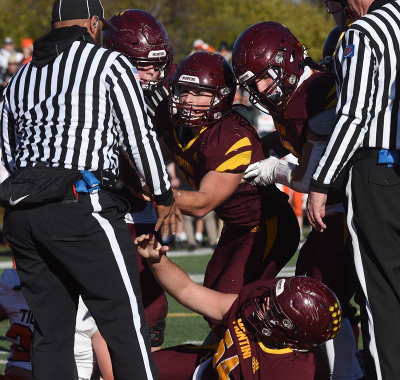 Joe Lewnard/jlewnard@dailyherald.com
Montini's Alex Marre, middle, looks toward the officials after the Broncos scored a touchdown during the Class 3A semifinal game in against Byron Saturday.