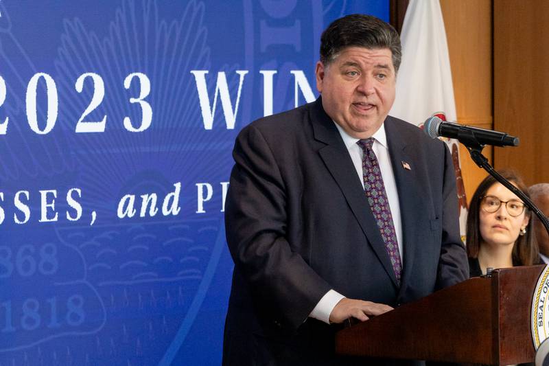 Gov. JB Pritzker speaks to reporters about the influx of migrants into Chicago from the southern border at a news conference on Wednesday.