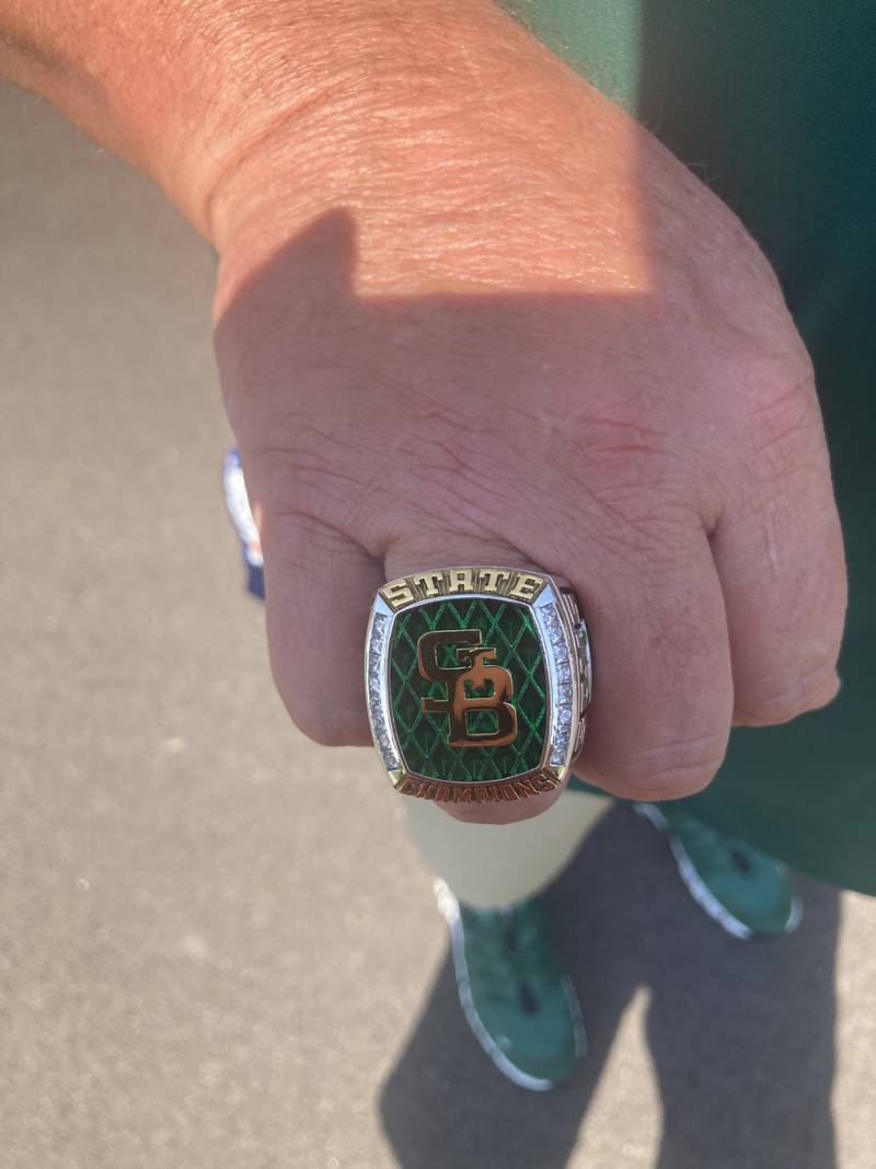 St. Bede coach Shawn Sons shows off his state championship ring Saturday.