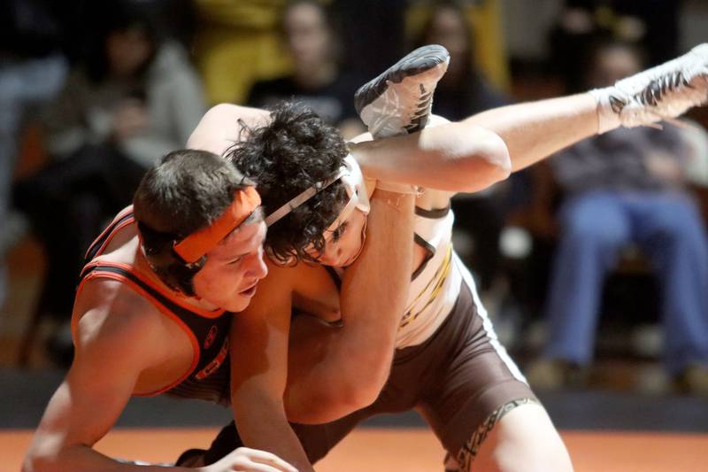 Crystal Lake Central’s Brandon Carbone, left,  battles Jacobs’ Ben Arbotante at 132 pounds in varsity boys wrestling on Tuesday, Jan. 20, 2026 at Crystal Lake Central High School in Crystal Lake.