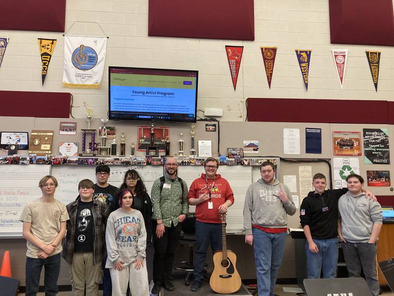 Ascher Taylor-Schroeder of Louisville, Kentucky visits Wyatt Onsen's Guitar Class on April 4, 2025, at Streator High School.