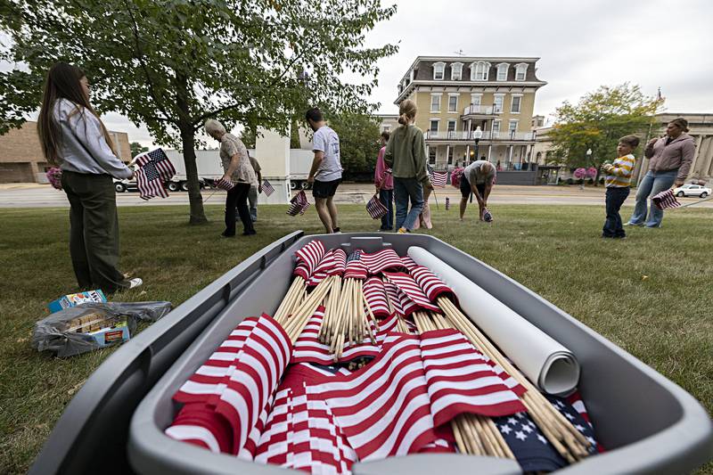 2,977 flags are being placed on the lawns of the Old Lee Courthouse and the Reagan Boyhood Home in Dixon Wednesday, Sept. 6, 2023.