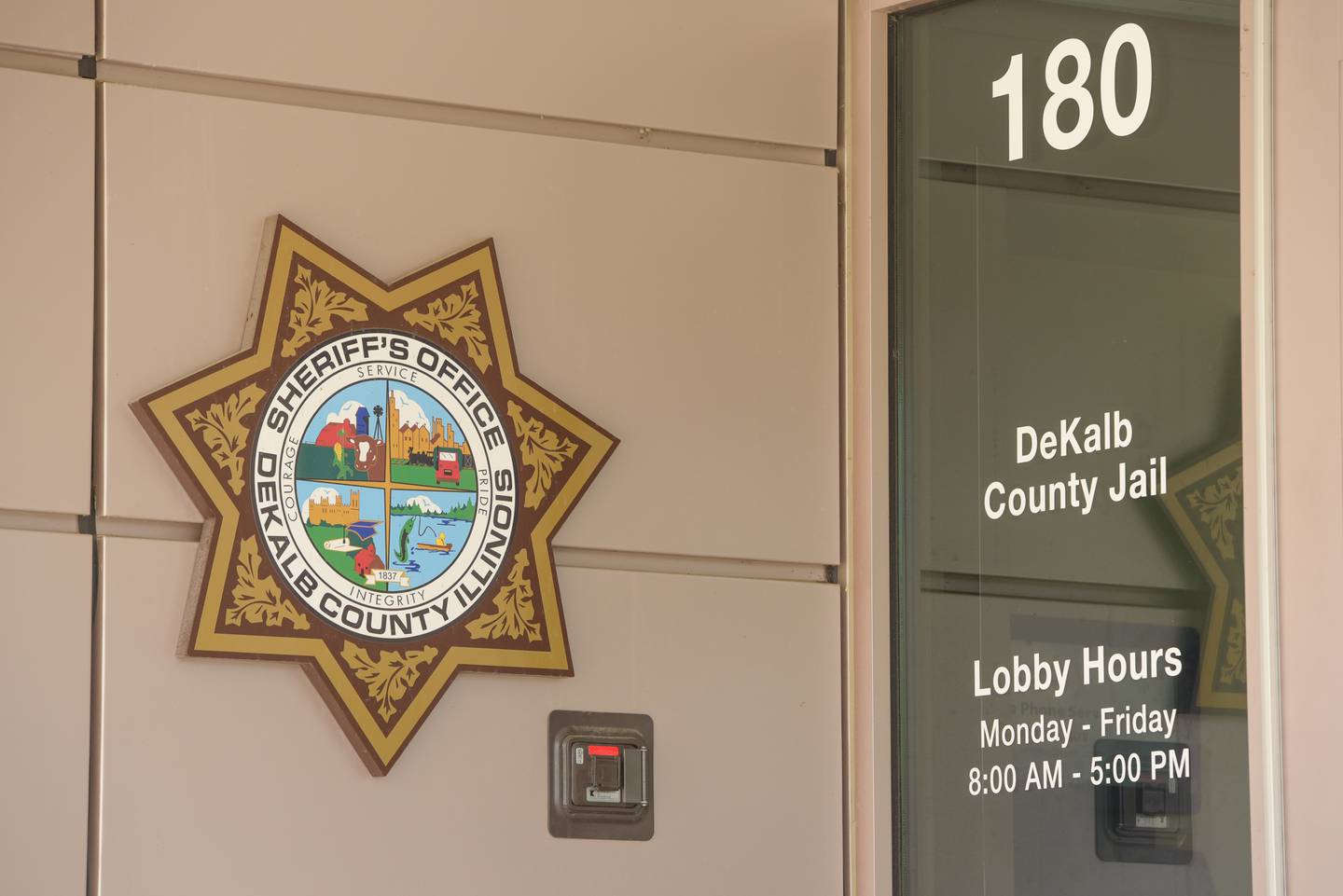 DeKalb County Jail and Sheriff's Office building sign and emblem in Sycamore, IL on Thursday, May 13, 2021.