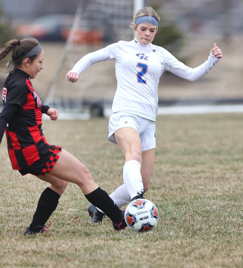 Indian Creek's Sally Diaz (left) and Genoa-Kingston's Adeline Valenti meet at the ball during their game Thursday, March 16, 2023, at Pack Park Sports Complex in Waterman.