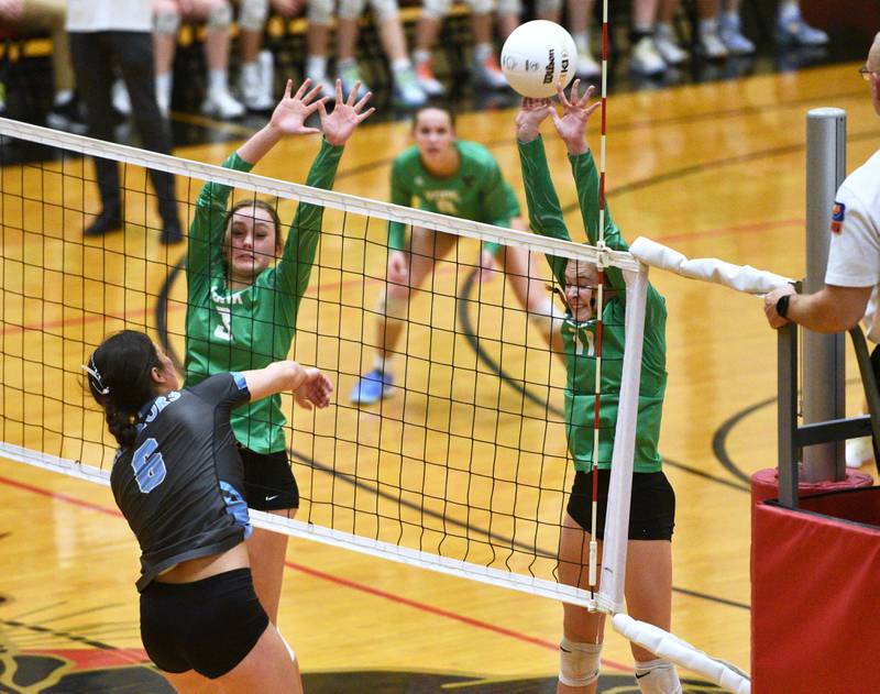 York's Katie Day (3) and Jessie Trapp (11) go up for the block against Willowbrook during Monday's Proviso West Class 4A girls sectional volleyball match in Hillside.