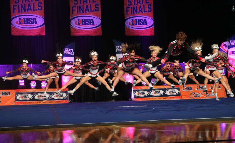Members of the Huntley cheerleading team perform during the Competitive Cheerleading State Finals on Saturday, Feb. 3, 2024 at Grossinger Motors Arena in Bloomington.