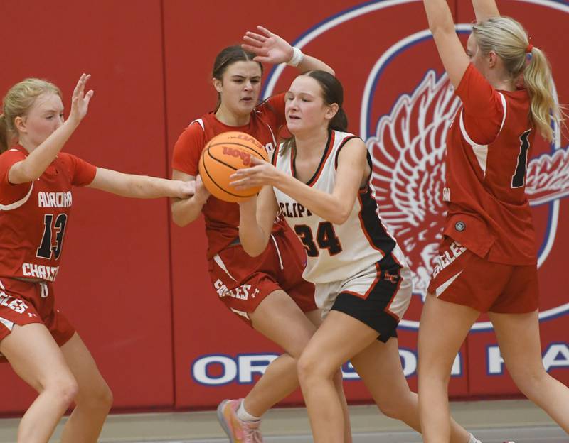 Amboy's Bella Yanos (34) is surrounded by Aurora Christian players at the Oregon Girls Tip-Off Tournament on Wednesday, Nov. 19, 2025  in Oregon.