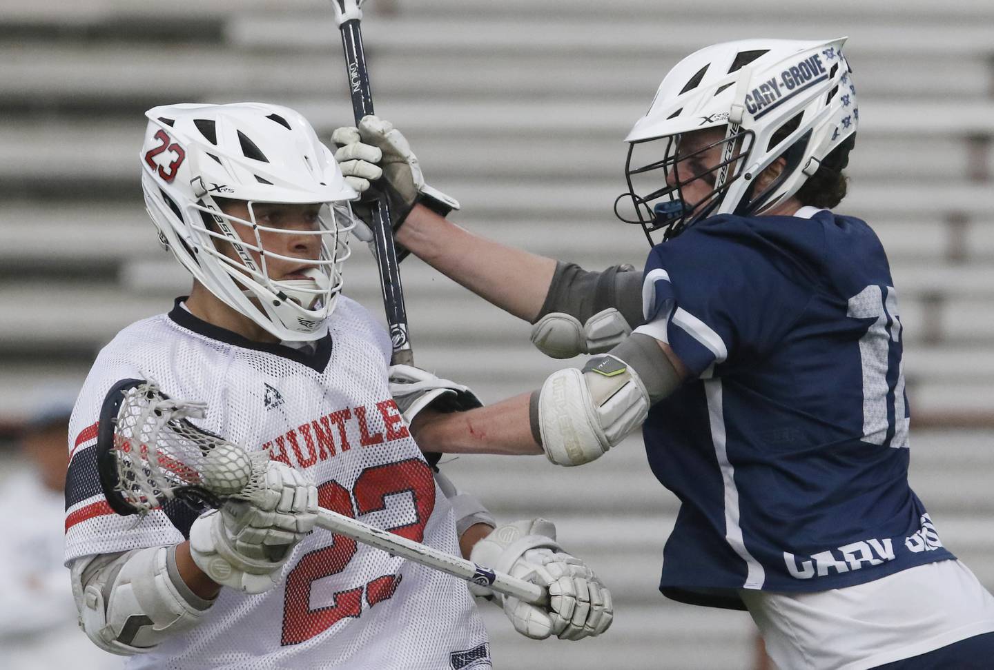 Huntley's Dominic Scarpelli is guarded by Cary-Grove's Jack Lamb during the Marian Central Sectional boys lacrosse semifinal match on Wednesday, May 28, 2025, at Marian Central High School in Woodstock.