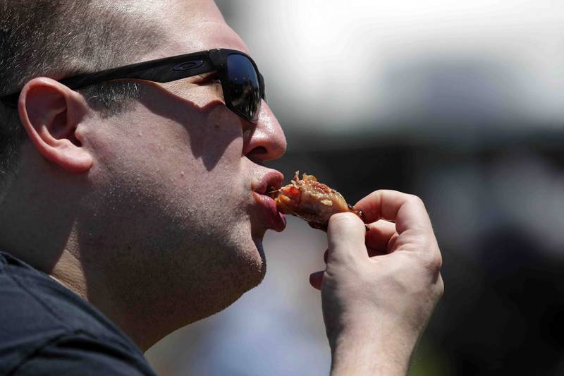 Nick Rudny of North Lake enjoys the last of his ribs during opening day of Ribfest Friday June 17, 2022 at the DuPage County Fairgrounds in Wheaton.