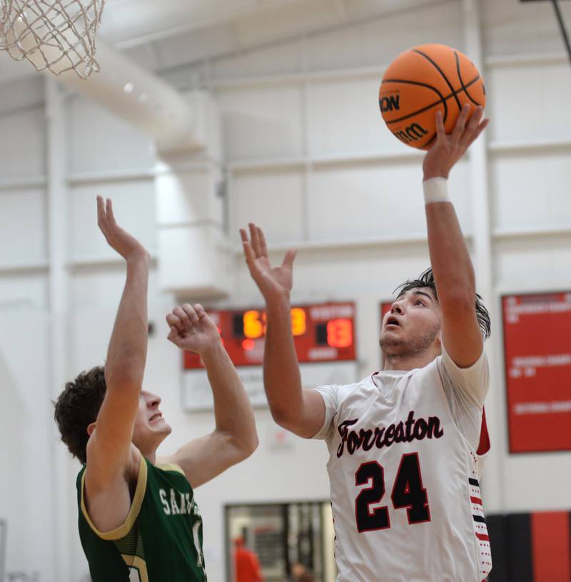 Forreston's Mickey Probst (24) shoots against Peru St. Bede on Wednesday, Feb. 26, 2025 action at the 1A Amboy Regional at Amboy High School.