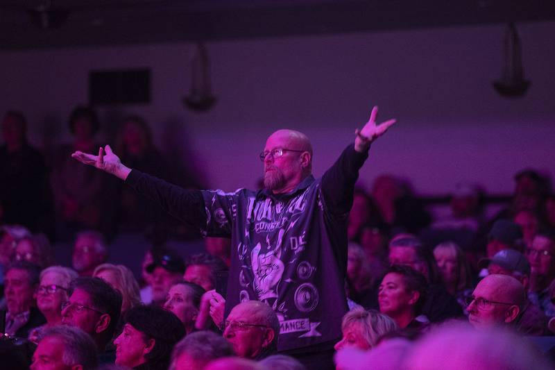 Fans of Head East sing along and gesture Saturday, April 22, 2023 during the band's show at the Dixon Historic Theatre.
