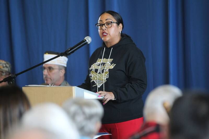 Paula Carballido, guest speaker and executive director with Lake County Honor Flight, addresses the audience during the Lindenhurst Veterans Day Ceremony at the Public Works garage behind the Village Hall on November 11th in Lindenhurst.
Photo by Candace H. Johnson for Shaw Local News Network
