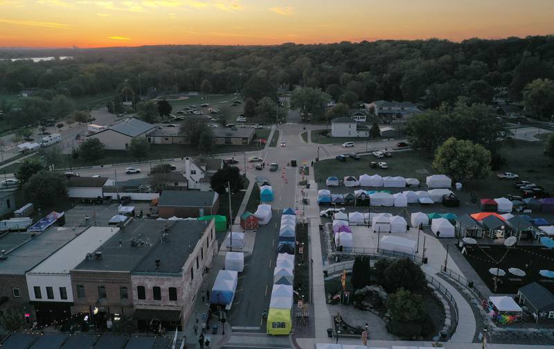 The sun sets over Church Street the night before the 55th annual Burgoo Festival on Sunday, Oct. 12, 2025 in Utica.