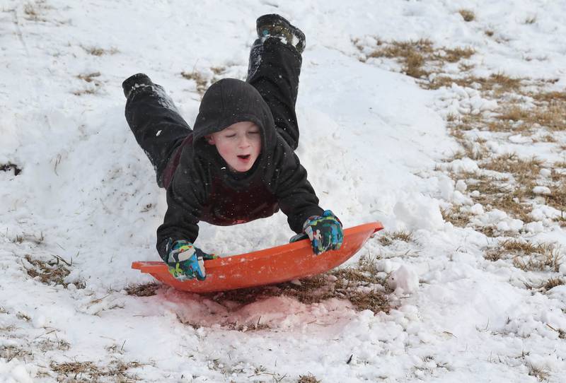 Sam Blank, 5, from Hinckley, catches some air on the Sycamore Park District Northwestern Medicine Sled Hill Wednesday, Jan. 25, 2023, in Sycamore.