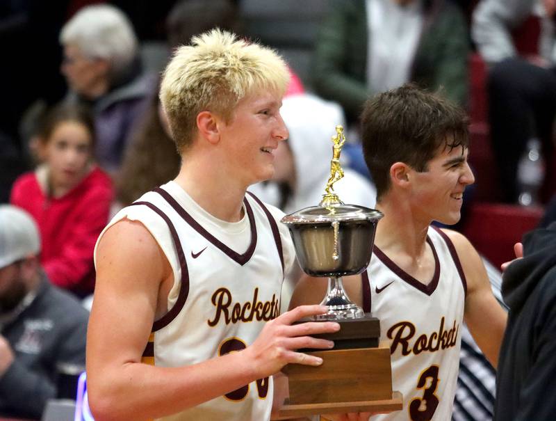 Richmond-Burton’s Luke Robinson, left, and Dane Gardner bring back the hardware after a win over Crystal Lake Central in varsity boys basketball E.C. Nichols tournament championship game action on Saturday, Dec. 27, 2025, at Homer “Bill” Barry Gymnasium on the campus of Marengo High School in Marengo.