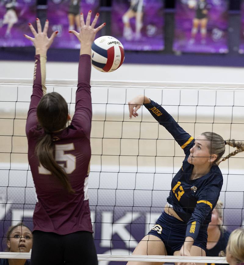 Sterling’s Marley Sechrest spikes against Morris’ Lily Hansen Tuesday, Oct. 29, 2024, at the class 3A regional semifinal in Dixon.