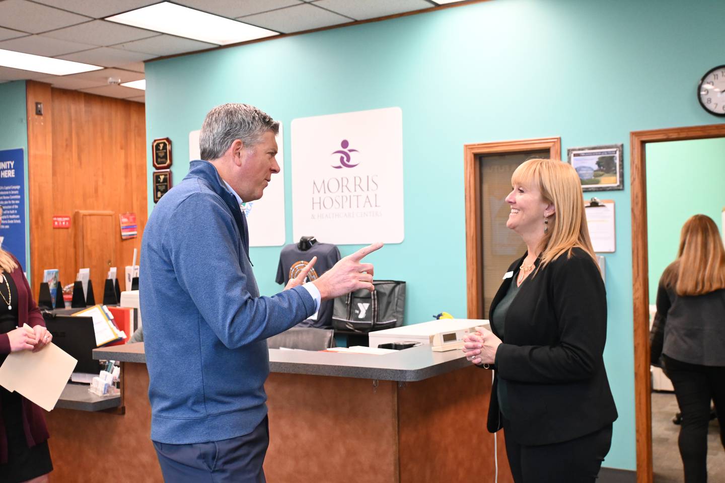 Missey Durkin, the Chief Operating Officer for the YMCA,  discusses the plans for the new building with Rep. Darin LaHood during his visit to Morris on Thursday.