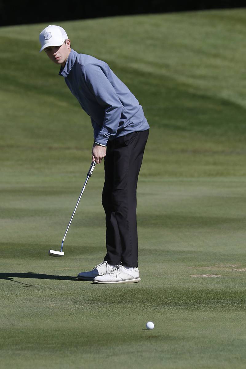 Crystal Lake South’s Nate Stewart watches his putt on the eighth green during the IHSA 2A Marengo Regional Golf Tournament Wednesday, Sept. 28, 2023, at Marengo Ridge Golf Club.