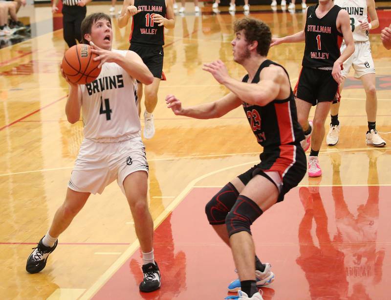 St. Bede's Logan Potthoff eyes the hoop while Stillman Valley's Ethan Szarkowicz defends during the 49th annual Colmone Class on Thursday, Dec. 7, 2023 at Hall High School.