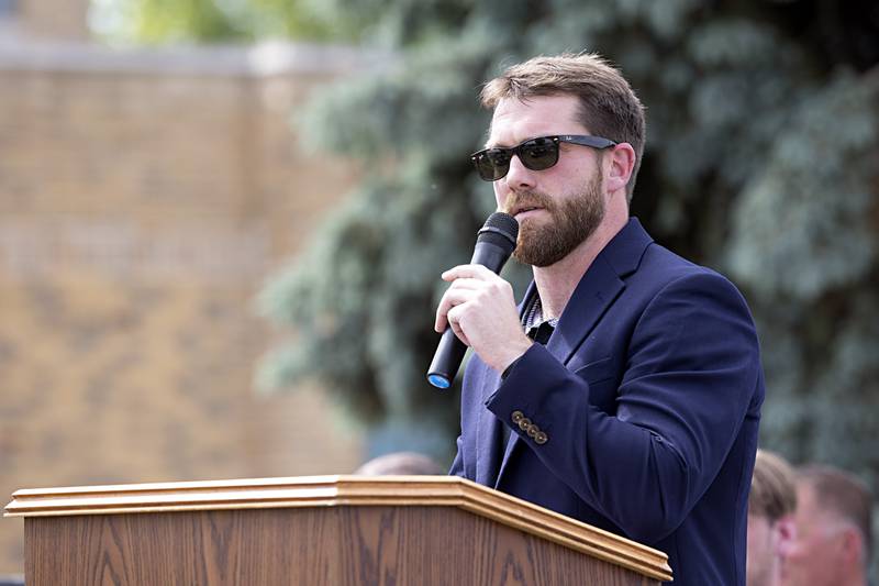 Dixon City Council Member Chris Bishop speaks to the crowd during a ceremony naming the road in front of Dixon High School as “Mark Dallas Way” on Tuesday, May 30, 2023.