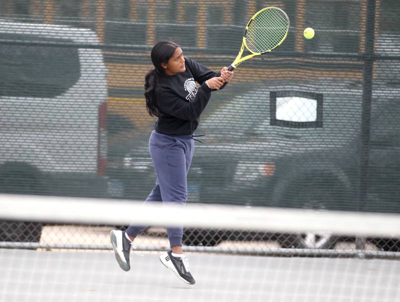 Plainfield North’s Santoshi Yadagiri returns the ball during the first day of the IHSA state tennis tournament at Fremd High School on Thursday, Oct. 20, 2022.