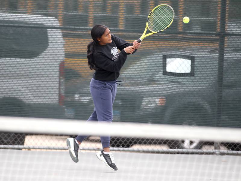 Plainfield North’s Santoshi Yadagiri returns the ball during the first day of the IHSA state tennis tournament at Fremd High School on Thursday, Oct. 20, 2022.