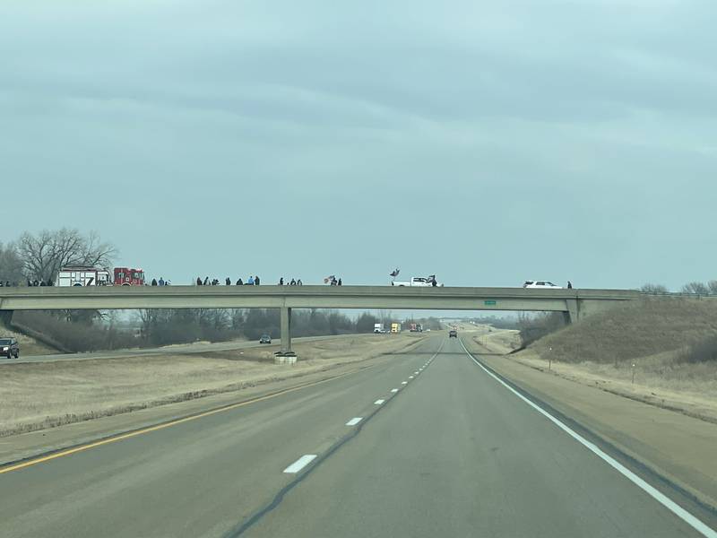 Overpasses on Interstate 39 are lined with firetrucks, flags and people Saturday, March 5, 2022, supporting the Midwest Freedom Convoy.