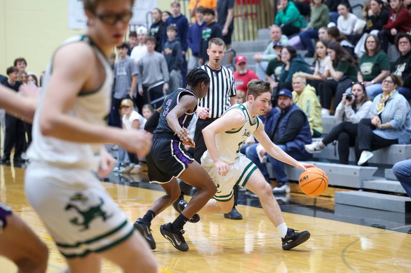 Bishop McNamara's Teddy Fogel brings the ball up during the Fightin' Irish's 66-52 victory over El Paso-Gridley in the IHSA Class 2A Herscher Regional championship on Friday, Feb. 27, 2026.