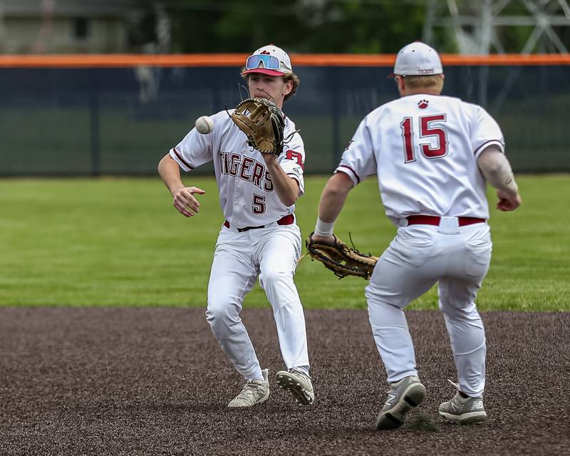 Plainfield North's Ryan Nelson (5) fields a hopper to second during the Class 4A Romeoville Sectional final game between Plainfield North at Oswego.  June 4, 2022.