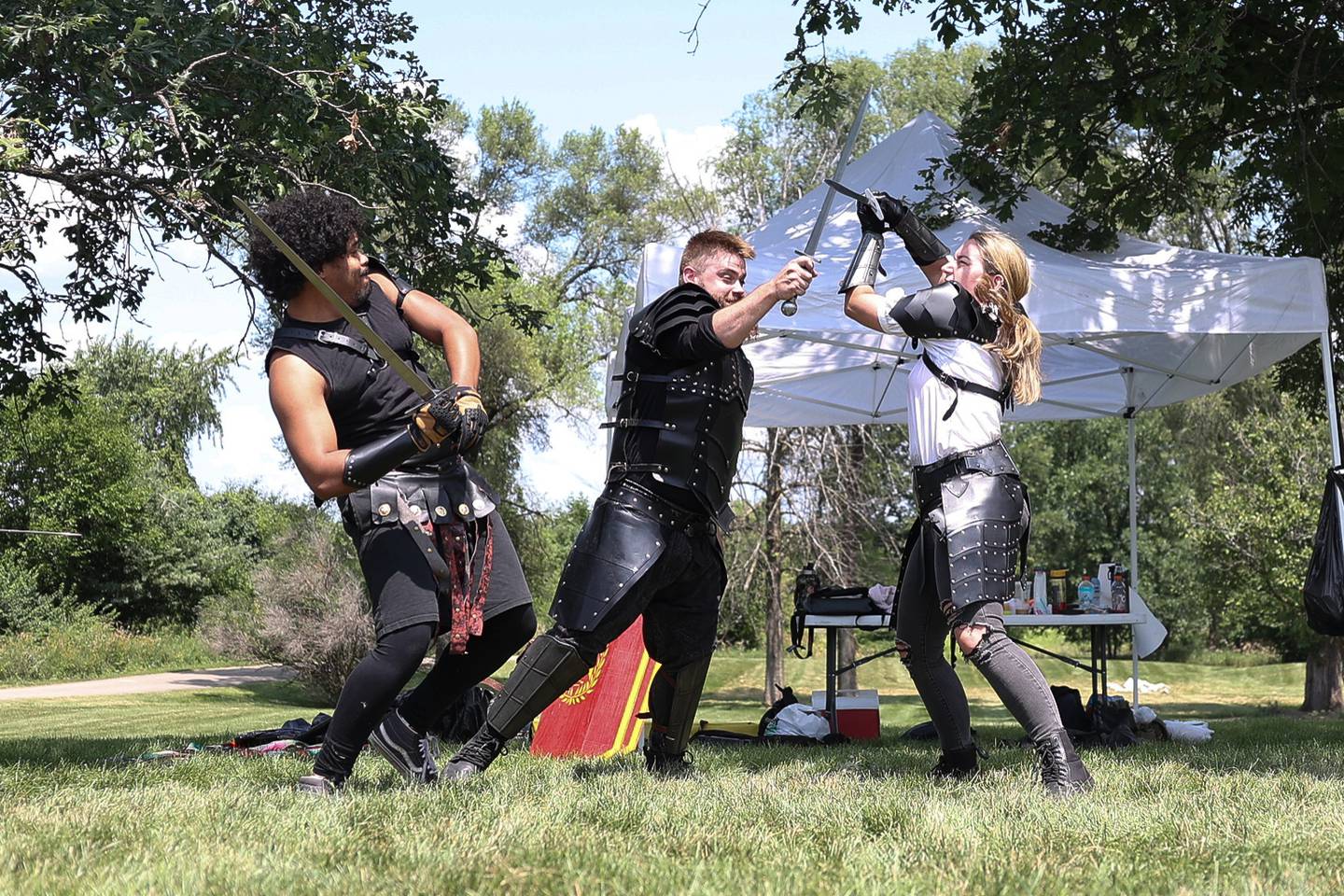 Members of the Joliet Drama Guild reenact at battle from a Shakespeare play at the Royal Faire hosted by the Joliet Public Library Black Road Branch on Saturday, July 22nd, 2023.