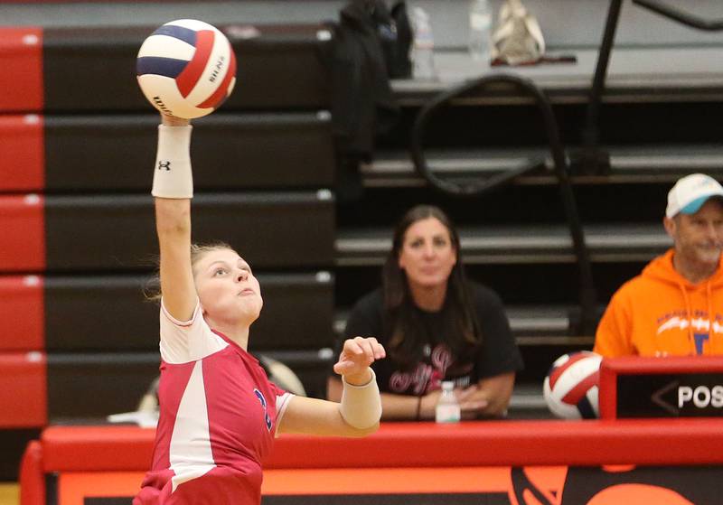Princeton's Caroline Keutzer slaps a kill against Hall on Thursday, Oct. 9, 2025 at Hall High School.