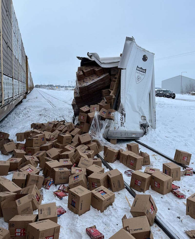 A semi from Mexico hauling a load of Hamburger Helper it picked up at Crest Foods in Ashton got hung up on the snowy, icy tracks at the Willow Road crossing east of Franklin Grove and was struck by a Union Pacific train, sending boxes spilling in the snow. The driver jumped free and was not seriously injured.not seriously injured.