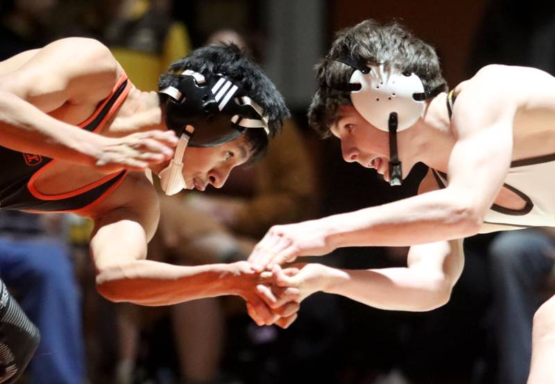 Crystal Lake Central’s Jair Viveros, left, battles Jacobs’ Nathan Flaskamp at 113 pounds in varsity boys wrestling on Tuesday, Jan. 20, 2026 at Crystal Lake Central High School in Crystal Lake.
